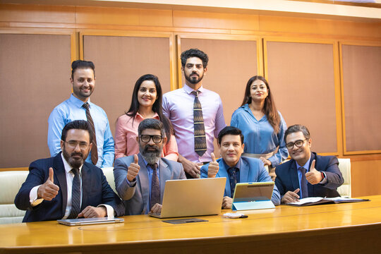 Indian Businesspeople attending conference meeting in modern office.