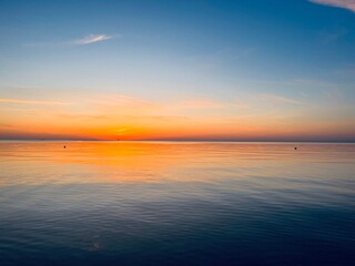 Orange sea sunset, orange sea horizon, clear blue sea, evening romantic sea coastline, no people