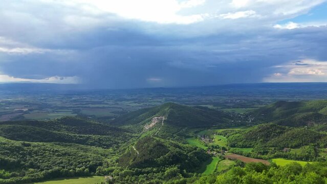 French countryside. Panoramic drone view of tree-covered hillsides and heavy rains of the Vercors, Val de Drome, France