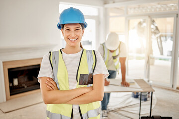 Portrait of woman, construction and home renovation with arms crossed, helmet and smile in apartment. Yes, positive mindset and renovations, happy female in safety and building project in new house.