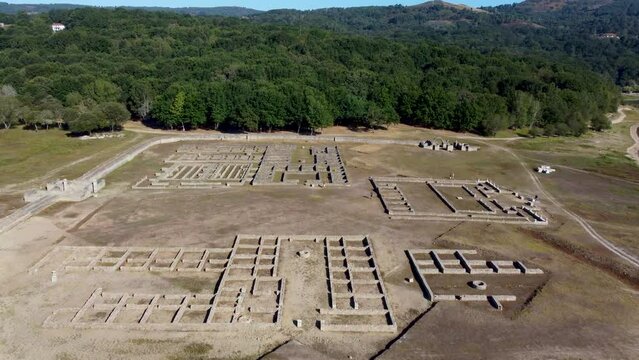 Aerial dolly above aquis querquennis, roman archeological settlement camp with walls