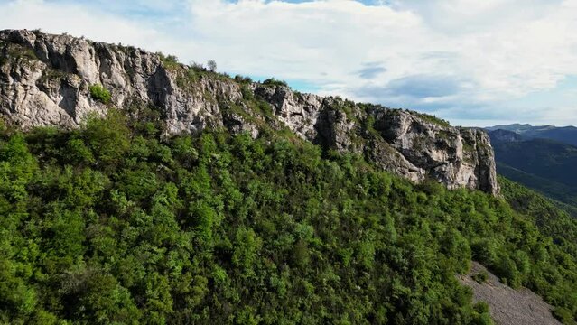 French countryside. Panoramic drone view of tree-covered hillsides of the heights of the Vercors, the marly hills and the valley Val de Drome, France