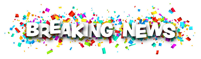 Breaking news sign over colorful cut ribbon confetti background.