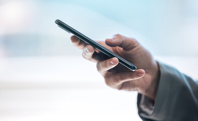 Phone, hand and communication with a business person typing a text message or email on a blurred background. Mobile, contact and networking with an employee browsing social media or texting closeup