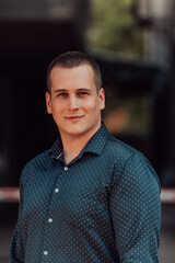 A portrait of a modern man, exuding confidence and style, against an outdoor backdrop, showcasing his charisma and fashionable demeanor.