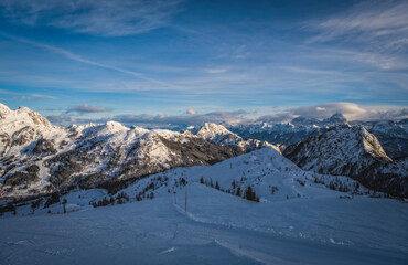 Fototapeta na wymiar Mountain ski resort Nassfeld near Hermagor, Austria - morning view of well prepared slopes with no people. January 2022