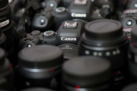 Brand new mirrorless digital camera Canon R6 closeup displayed at a photo workshop.