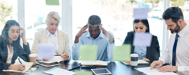 Meeting, planning and stress with a business team in a boardroom for strategy during a financial crisis. Finance, compliance or regulations with a group of colleagues in an office for problem solving