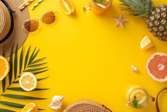 Indulge in the essence of summer relaxation with this captivating top view flat lay. Sunhat, palm leaves, sunglasses, citrus fruit, bag, and drinks on a vibrant yellow background with empty space