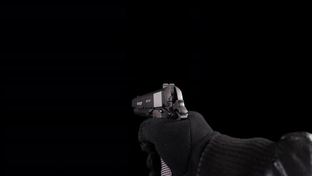 Man Shoots From The Gun on black background