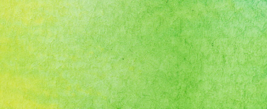 green, yellow watercolor, paint stroke gradient color combination on drawing paper use as background