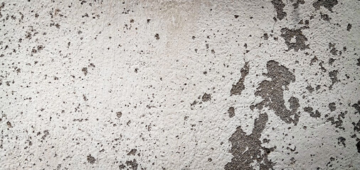 Texture of a concrete wall with cracks and scratches which can be used as background, texture, backdrop 
