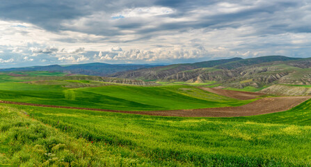 Fototapeta na wymiar Farming on eroded soils and green crops and fallow lands in central Turkey.