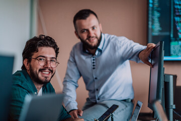 Programmers engrossed in deep collaboration, diligently working together to solve complex problems...