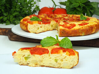 Spanish omelette with potatoes, tomatoes and zucchini