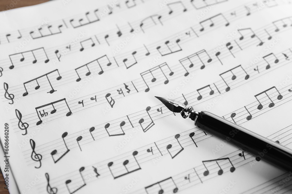 Wall mural sheet with musical notes and fountain pen, closeup