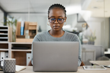 Laptop, office and business black woman typing online for research, internet and browse website....