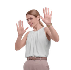 Beautiful businesswoman avoiding something on white background