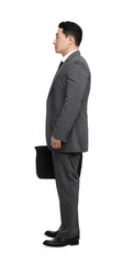 Businessman with briefcase posing on white background