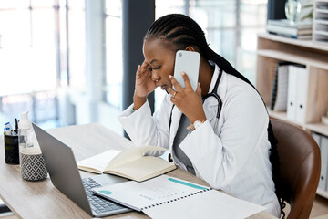 Hospital, doctor and black woman with stress on a phone call for conversation, talking and discussion. Healthcare, burnout and female worker on smartphone for medical service, consulting and help