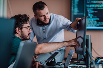 Programmers engrossed in deep collaboration, diligently working together to solve complex problems...