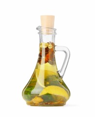 Glass jug of cooking oil with spices and herbs isolated on white