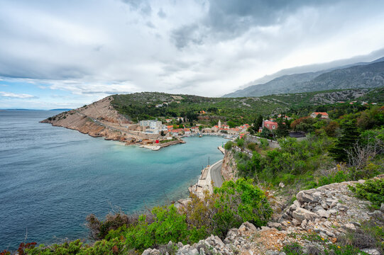 Panoramic view with the picturesque town of Jablanac in coast of Adriatic sea in Croatia on a cloudy spring day