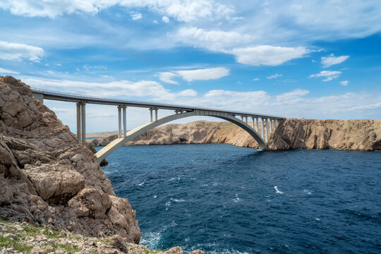Amazing view with Pag bridge at Pag island in Croatia with beautiful clouds and vibrant sea