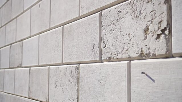 White brick wall made of marble