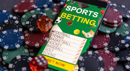 Mobile phone with bets, cards, chips, cubes and money dollars. Concept application for smartphone gambling, electronic casino online