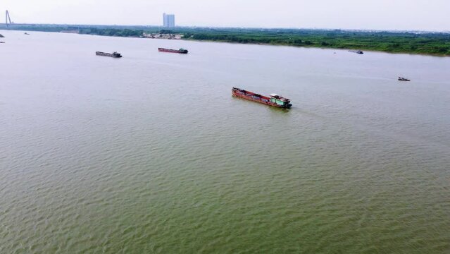 a cargo ship sailing down a river