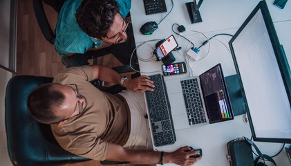 Programmers engrossed in deep collaboration, diligently working together to solve complex problems...
