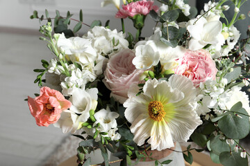 Obraz na płótnie Canvas Bouquet of different beautiful flowers indoors, closeup