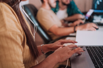 Close up image of woman hands typing on laptop computer keyboard and surfing the internet on office table, online, working, business and technology, internet network communication concept