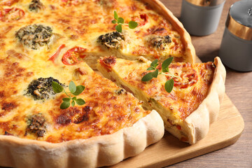 Delicious homemade vegetable quiche on table, closeup