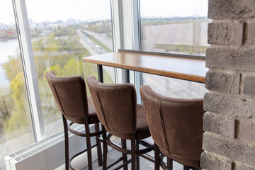 Three chairs in a row in the interior of the room