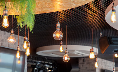 Decorative antique edison style filament light bulbs hanging from ceiling