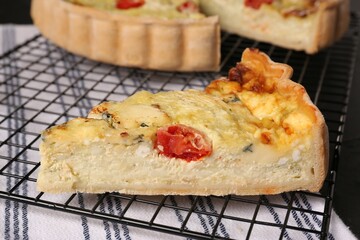 Piece of delicious homemade cheese quiche, closeup