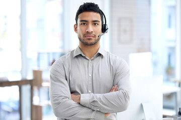 Call center, man and portrait with arms crossed in office, telemarketing or serious face for crm...