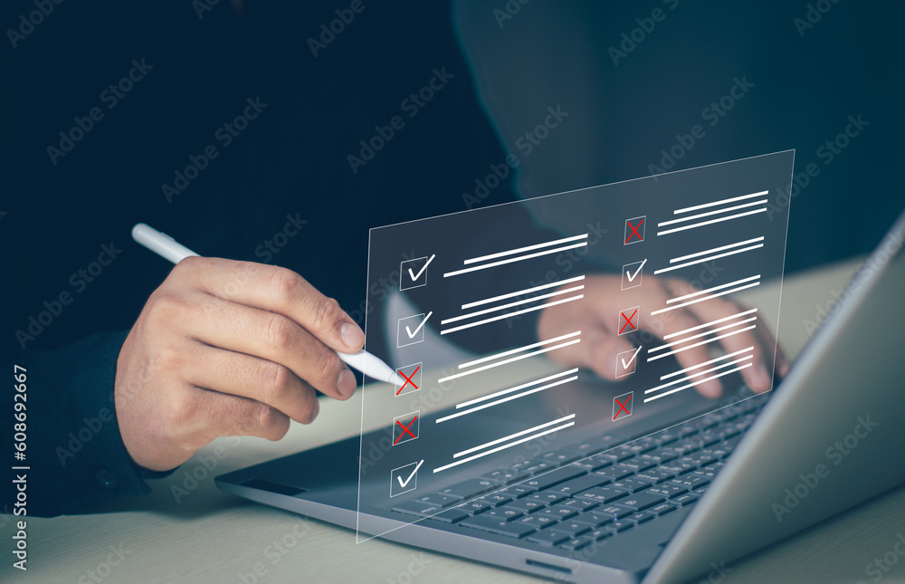 Wall mural businessman working on laptop computer productivity document management system dms. assessment form,