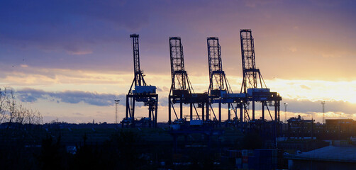 Four Felixstowe Dock Cranes at sunset