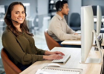 Woman typing at computer, call center and contact us with communication and CRM with tech support. Customer service, help desk and telemarketing, female consultant and smile in portrait with telecom - obrazy, fototapety, plakaty