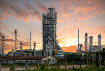 Industry, petrochemical refinery and gas kettle at sunset