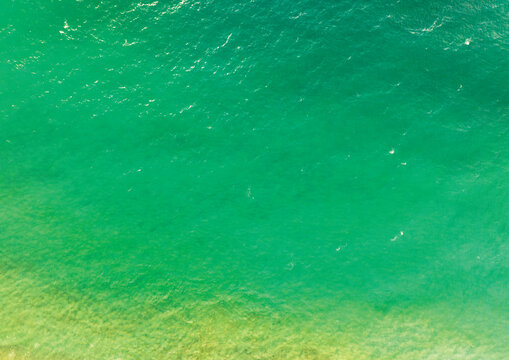 Sea surface aerial view,Bird eye view photo of crashing waves and water surface texture,Green sea background, Beautiful nature seascape,Amazing view sea background