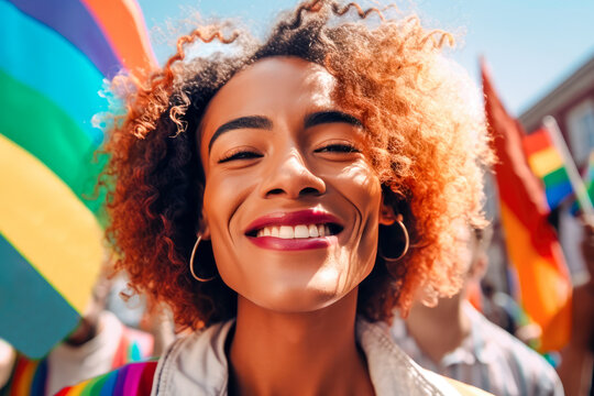 Generative AI illustration of delighted young Hispanic woman with curly hair and earrings smiling and looking at camera against LGBT flags
