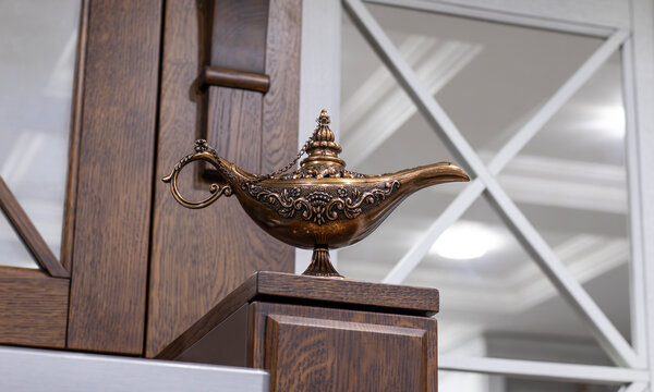 Beautiful oriental lamp made of metal with carved patterns. Oriental Aladin Lamp.