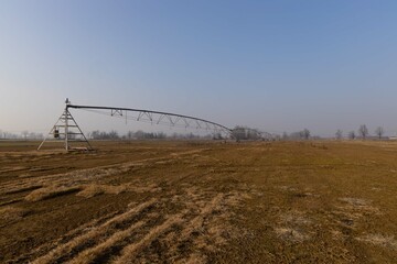 fields to cultivate in the rice fields adjacent to the town during a sunny winter day