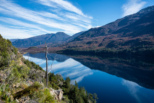 View of the Andean mountains reflected on Lake Los Moscos. Villa Mascardi area, in the Nahuel Huapi National Park, in autumn. Argentina.