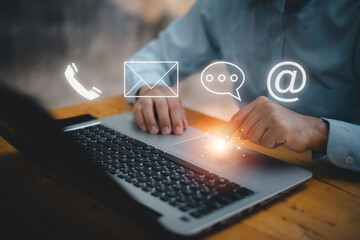 Businessman using Smart Phone with the email, call phone, address, Chat message icons.Customer support hotline Contact us people connection.
