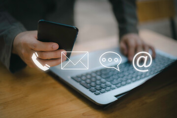 Businessman using Smart Phone with the email, call phone, address, Chat message icons.Customer support hotline Contact us people connection.